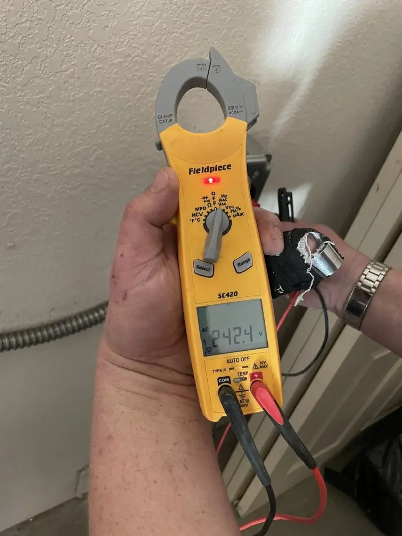 Voltage testing with clamp meter during Electrical Installation Services in Keyport